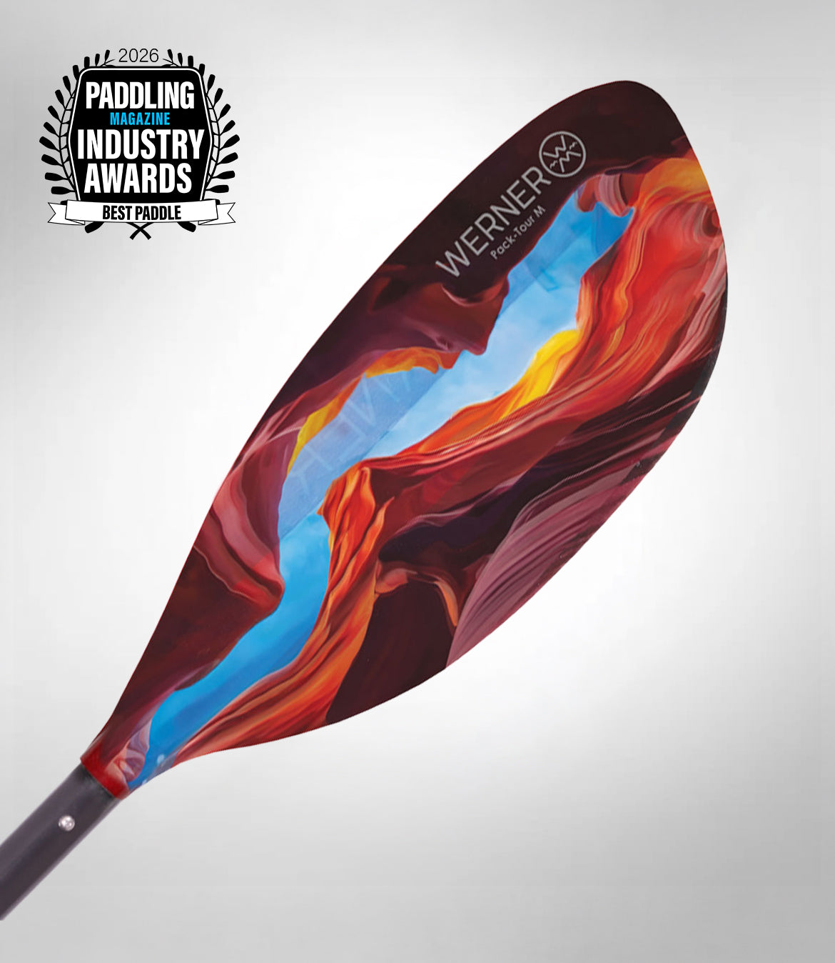 Colorful kayak paddle with 'Werner' branding on a gray background, featuring the 2020 Paddling Industry Awards logo.